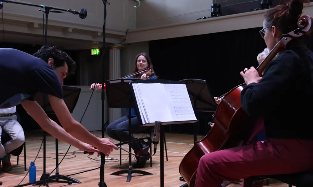A string session been recored in a music hall