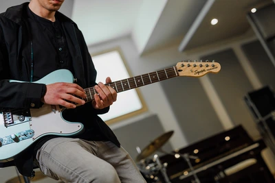 Guitarist close up in the studio