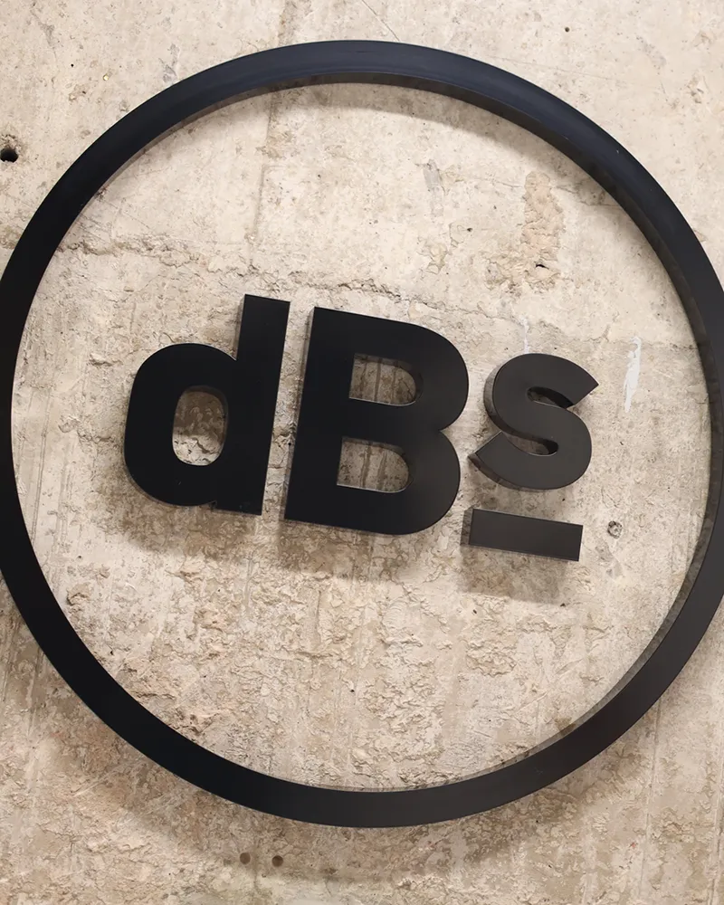 dBs Institute of Music wall signage in a studio corridor