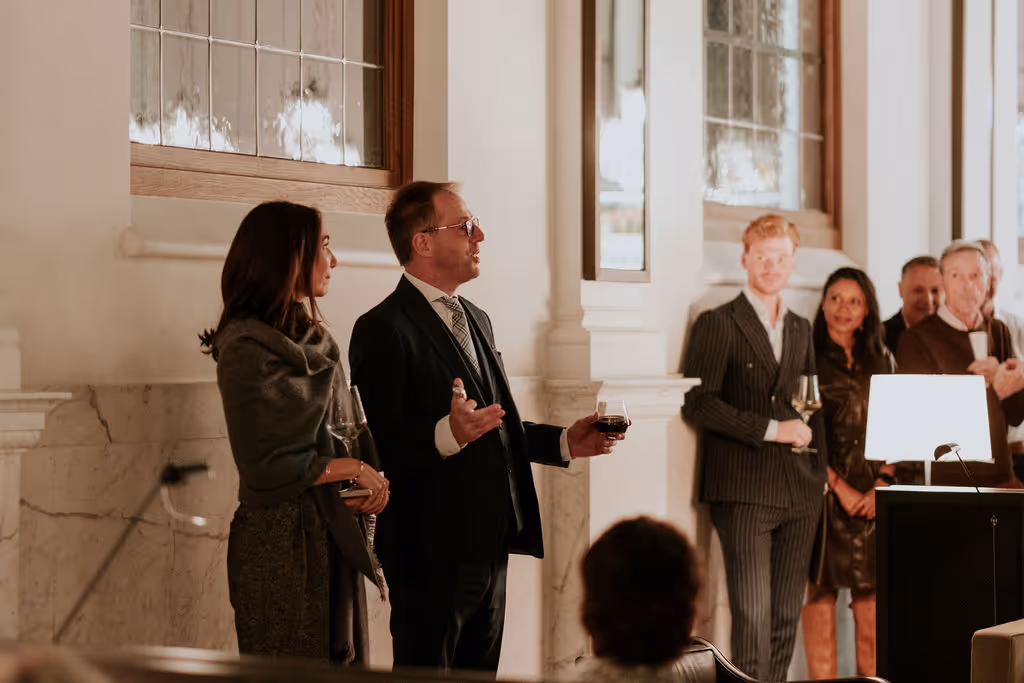 Man and woman making a speech in luxurious space, for an intimate evening event