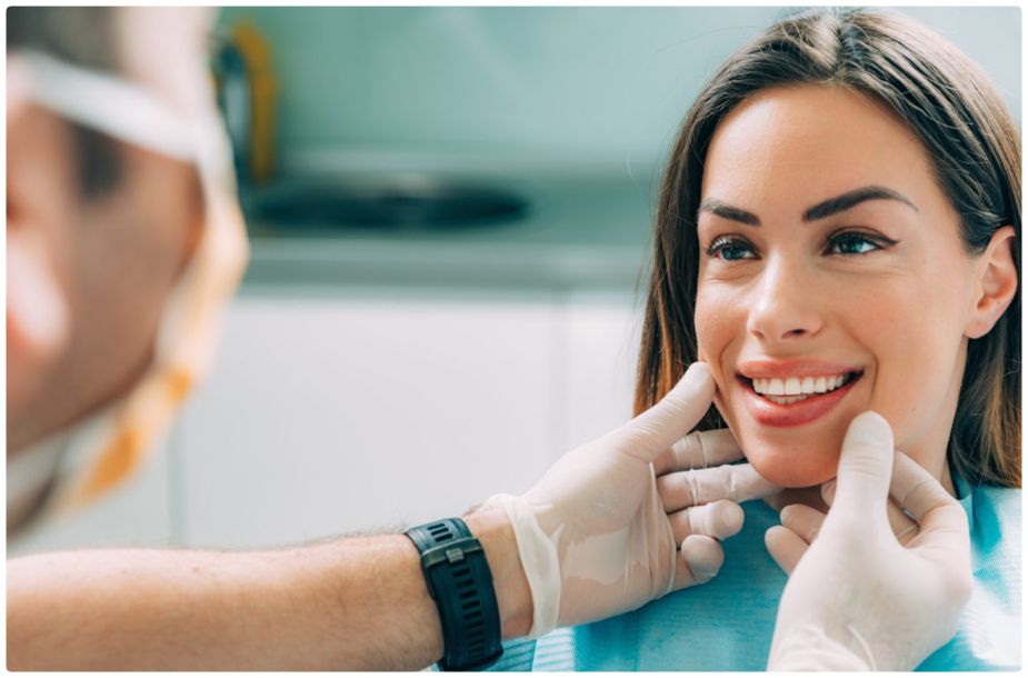 Achieving a Local Smile Transformation at Our Dental Practice: A Patient Smiles with Doctor After SureSmile in Highland, IN