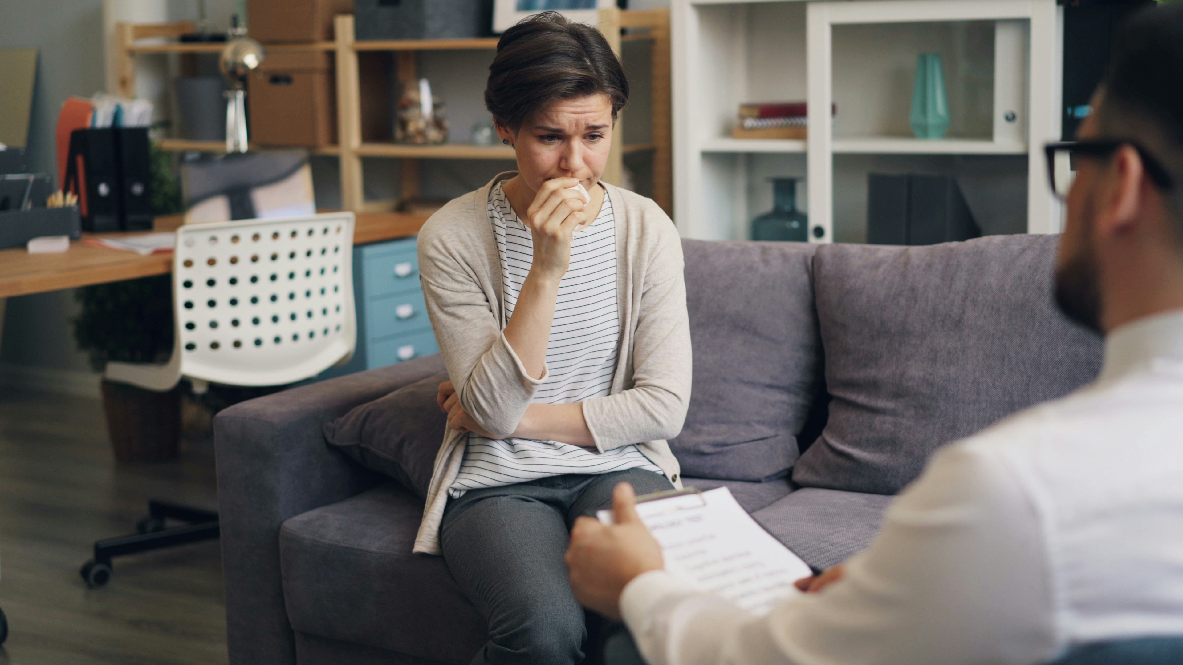 A psychologist discussing therapy options with a patient