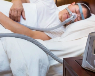 Patient with sleep apnea using CPAP machine before bariatric surgery.