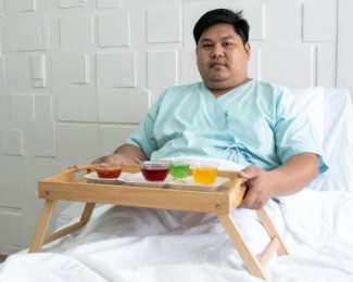 Patient recovering in hospital after bariatric surgery with a temporary liquid diet.