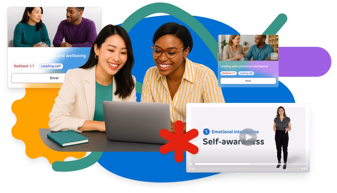 Two women using a laptop to explore RedSeed courses on emotional intelligence, stress and self-awareness.