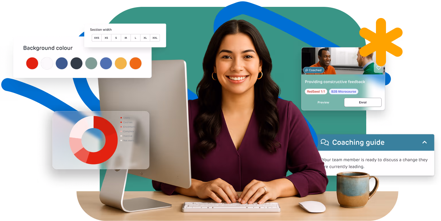 Smiling user at a computer using RedSeed’s all-in-one platform with integrated coaching, course design, and reporting tools.
