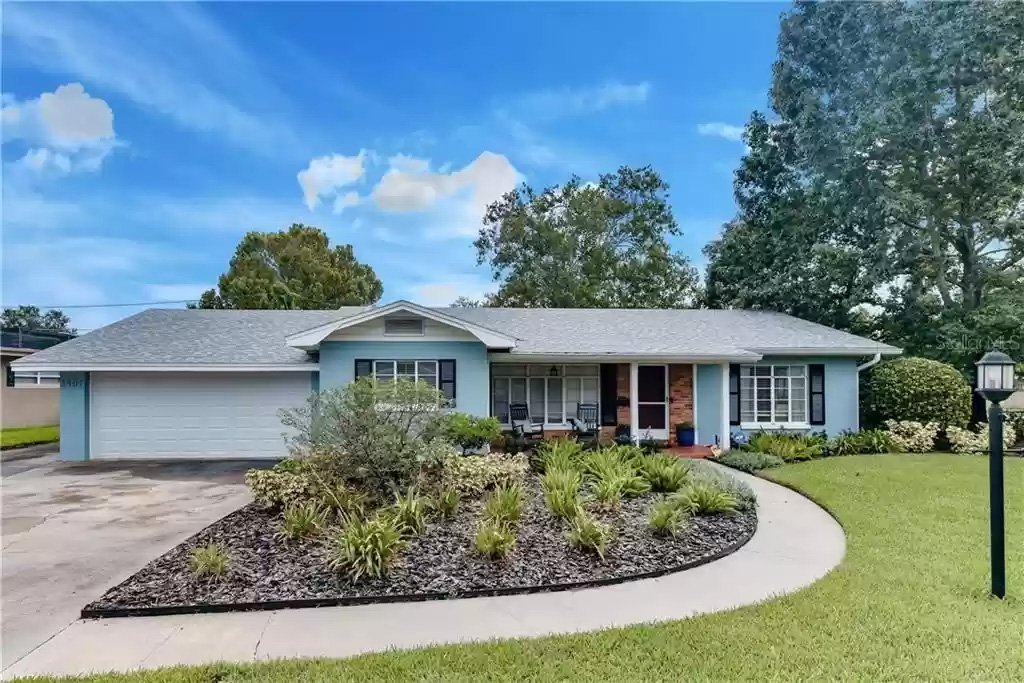 Single-family investment property with front lawn and circular driveway in Central Florida