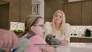 Anne-Marie Wurzel, top Central Florida Realtor, talking with a young client at a kitchen island during a home consultation.