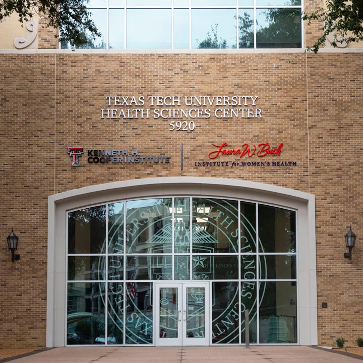 The exterior of a building with a sign of the Kenneth H. Cooper Institute logo