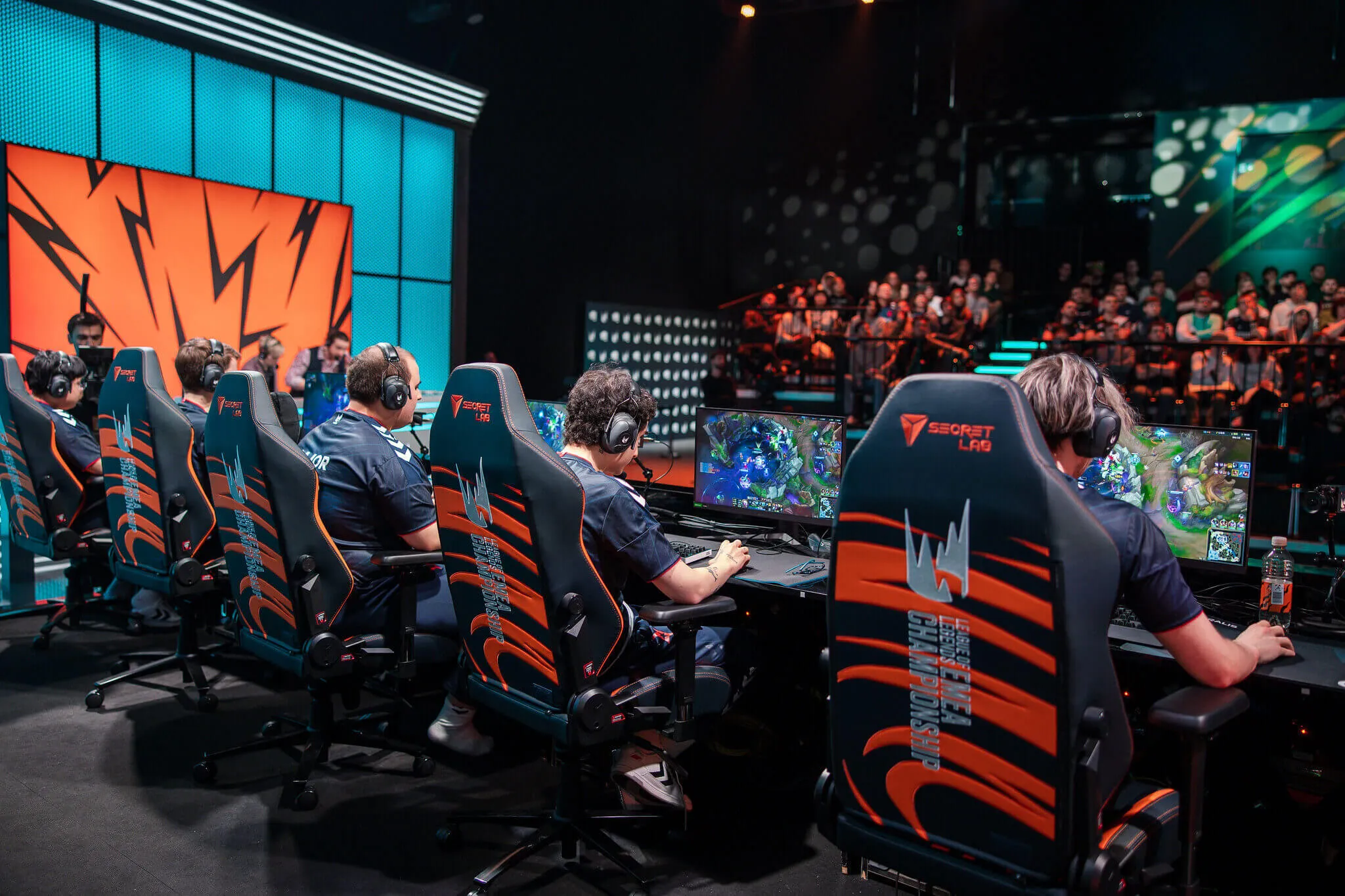 Esport game tournament with team playing game in front of crowd