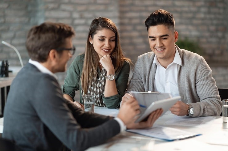 Young happy couple having consultations with bank manager on a meeting in the office, Picture