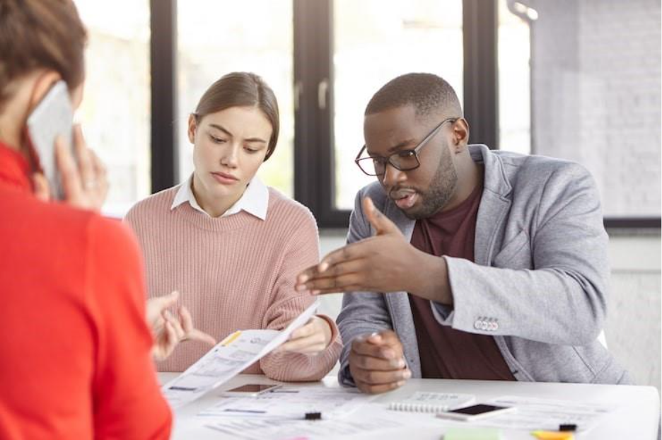 Group of employees working in office