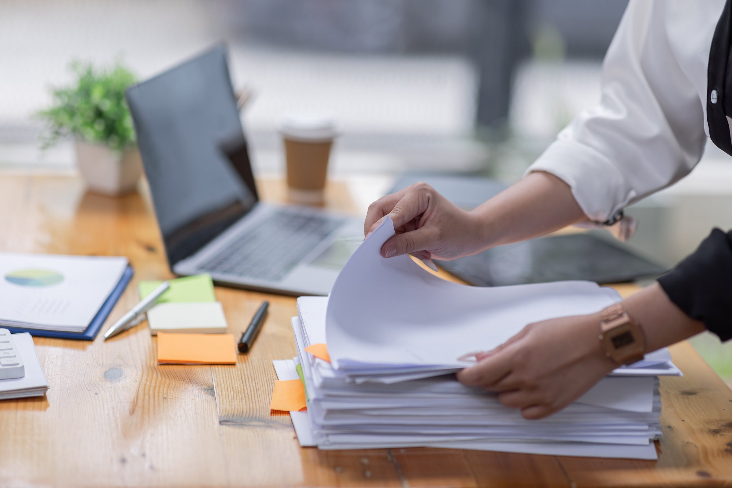 Reviewer at desk going through documents
