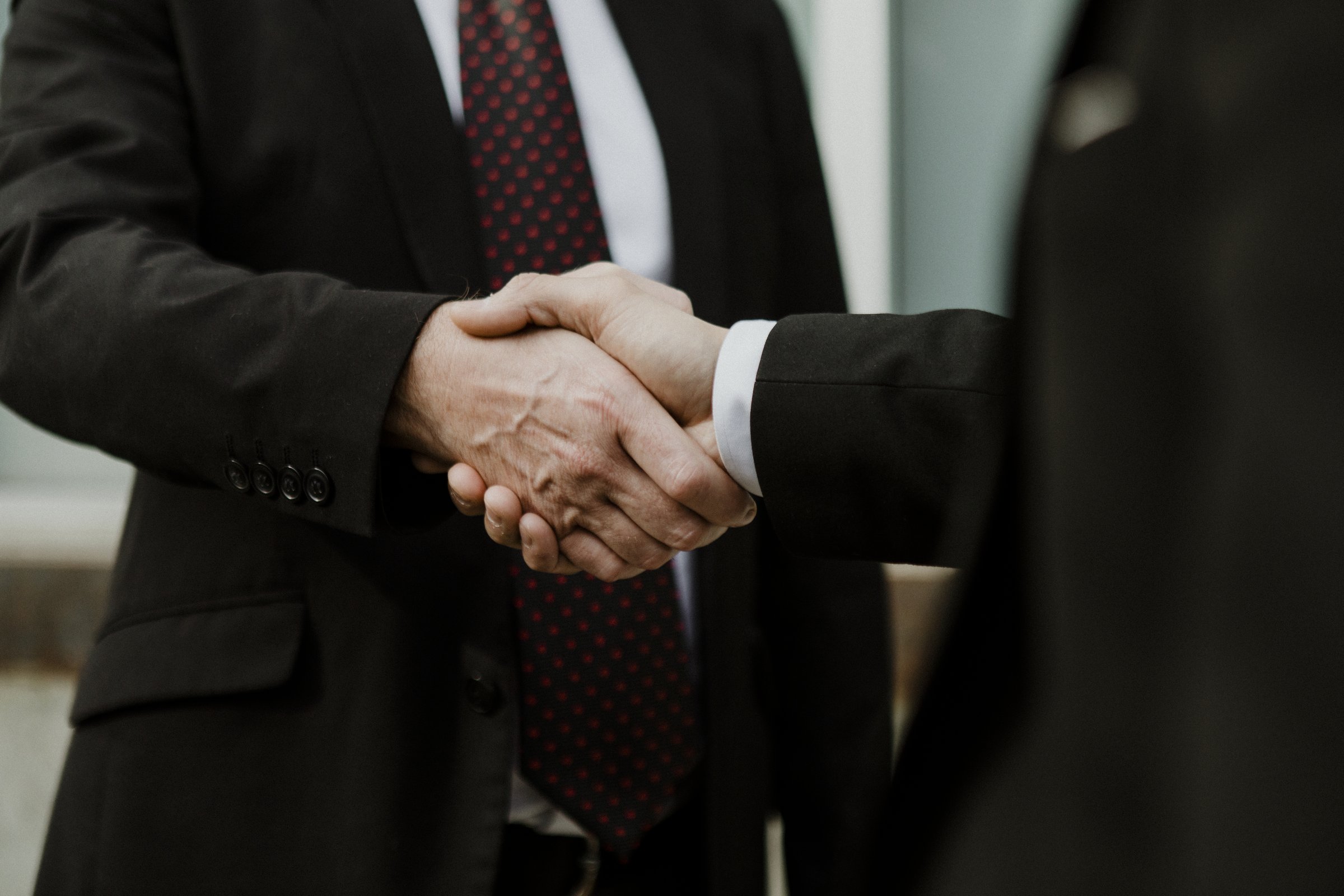 Two business people shaking hands on an agreement