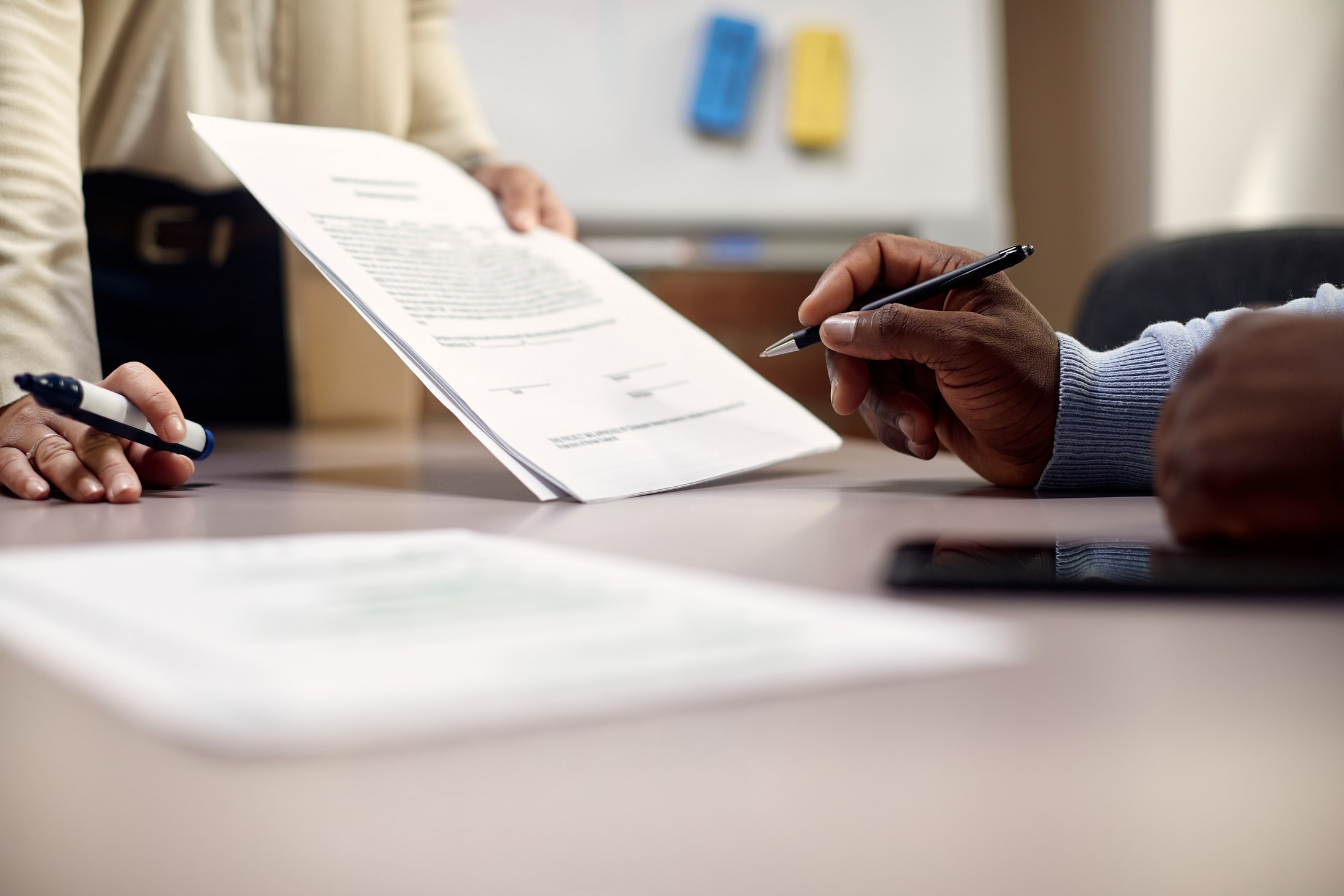 Two people reviewing a document