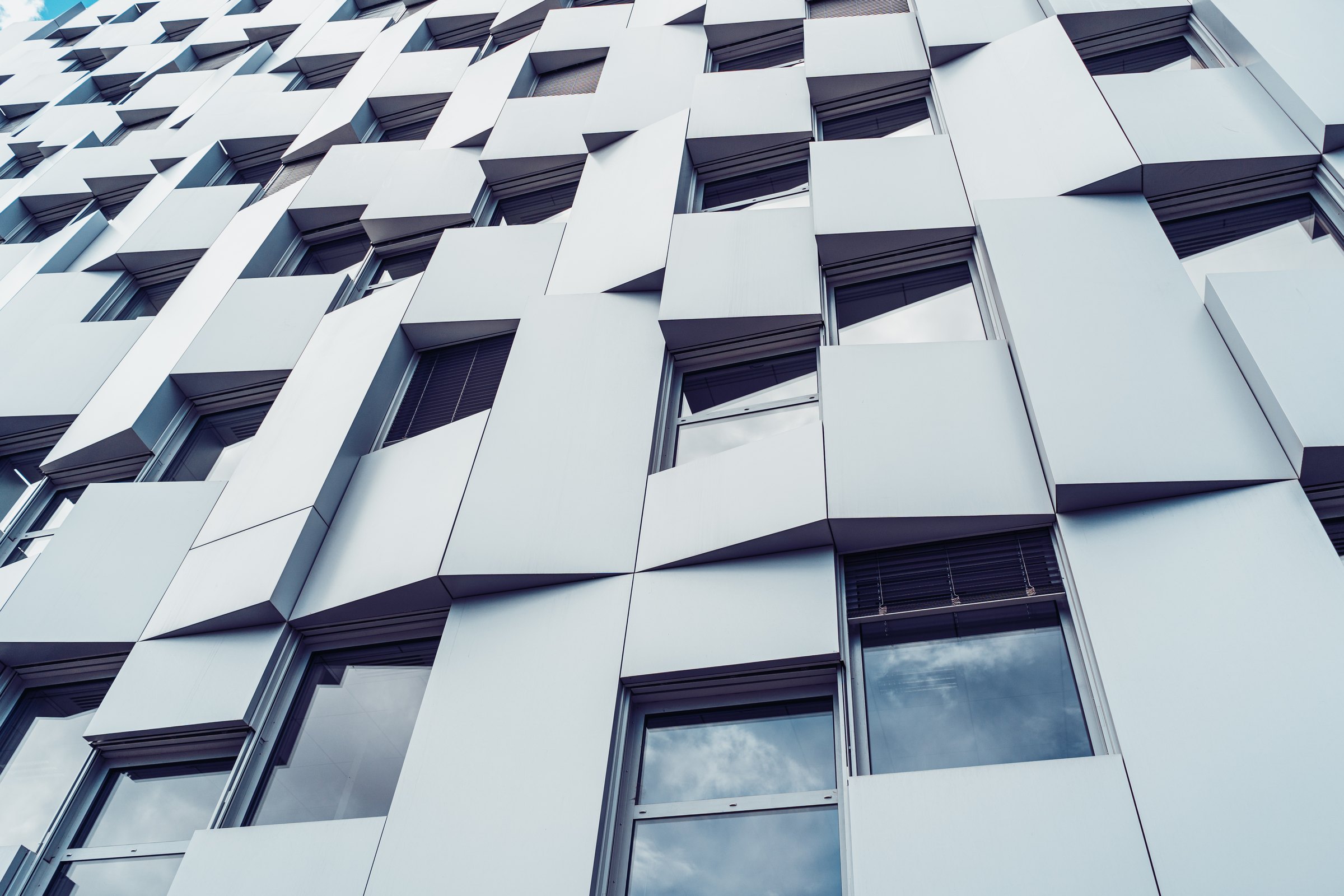 Geometric white facade of a modern commercial building