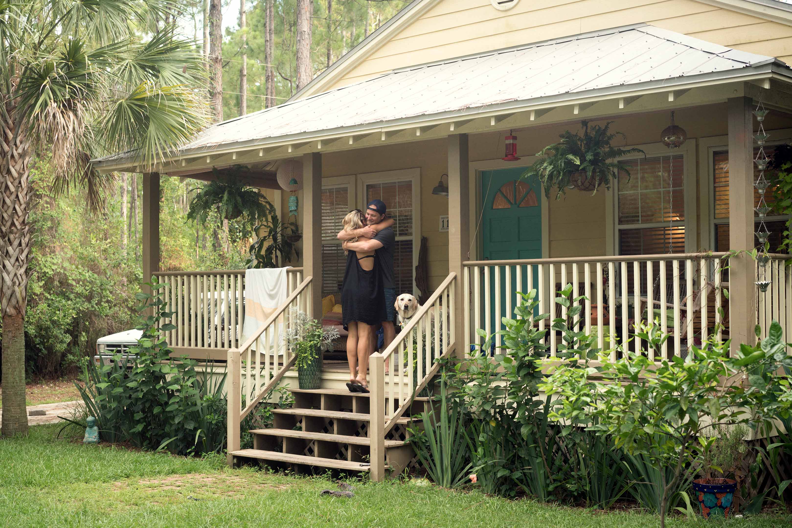 Florida Co-Owners outside of their newly purchased home, demonstrating co-ownership in Florida.