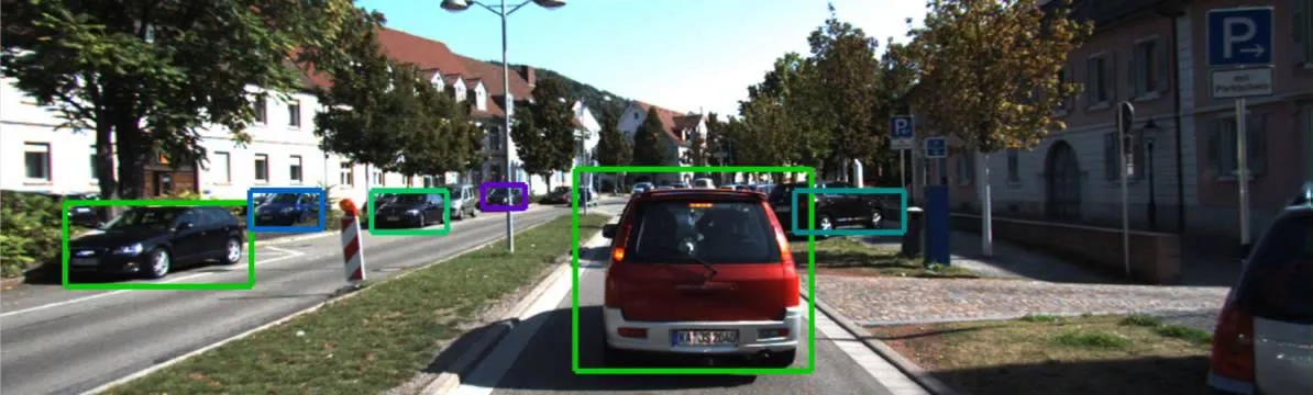 A screenshot depicting bounding boxes around cars on a street