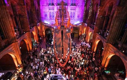 Banquet tables with architectural lighting in a listed venue