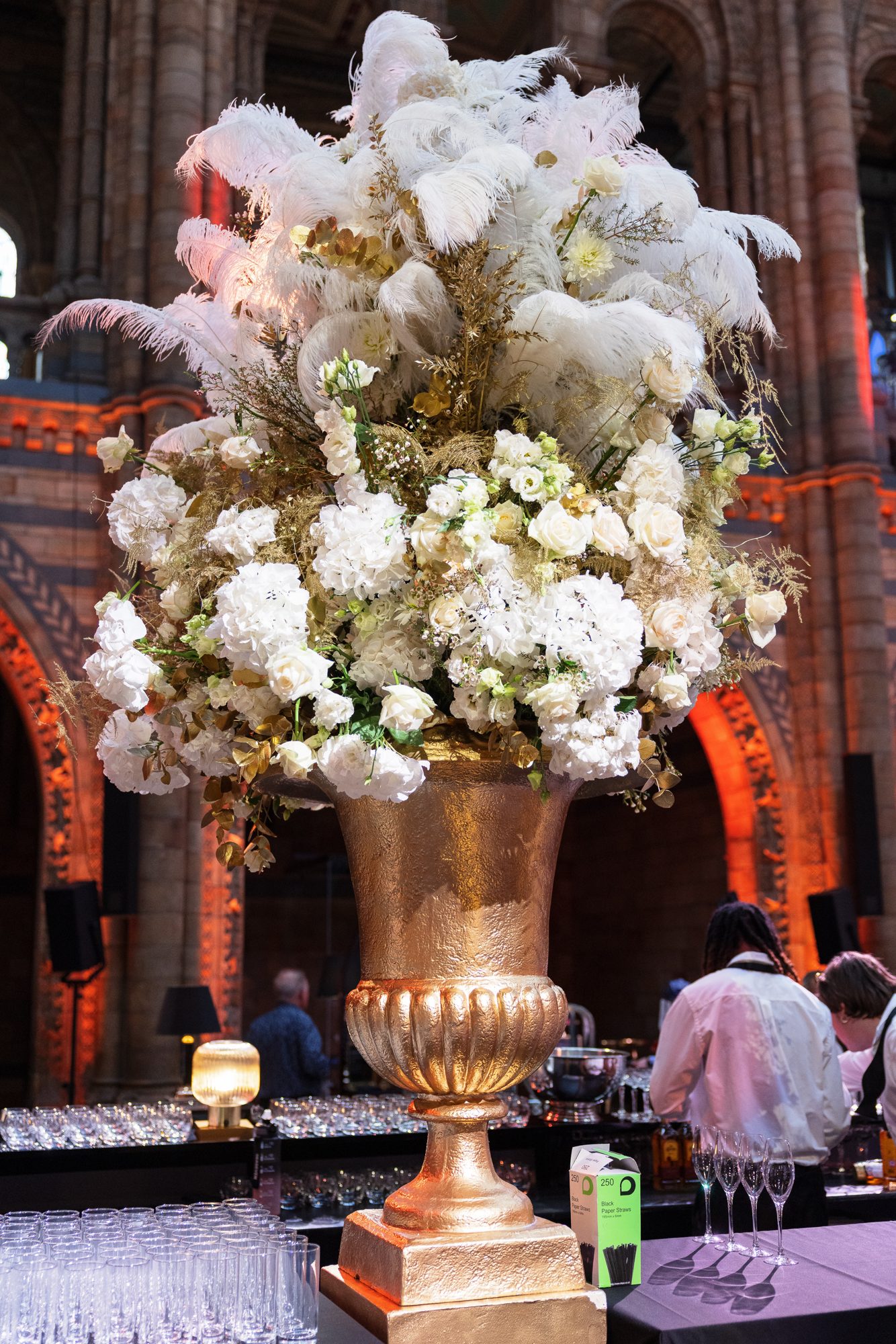 The gold urn floral and ostrich-feather centrepiece