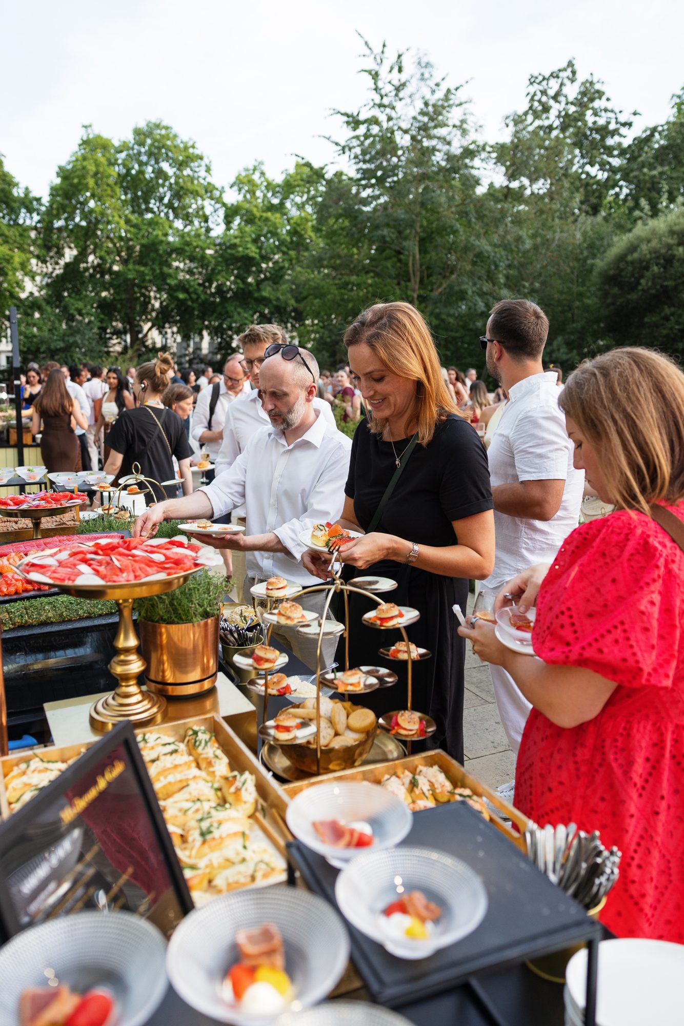 Guests at the outdoor food stations during the reception