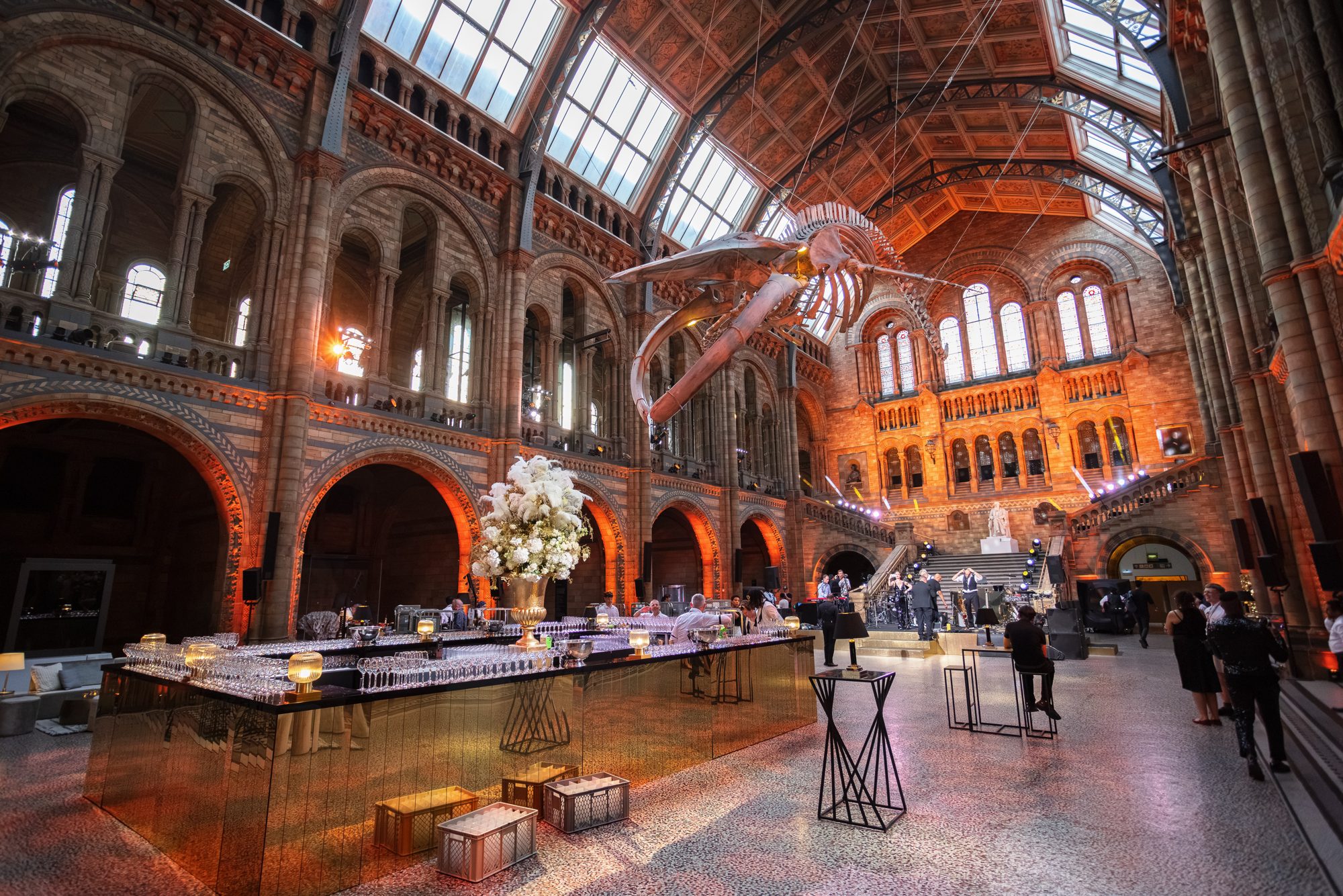Hintze Hall transformed with gold bar and statement florals