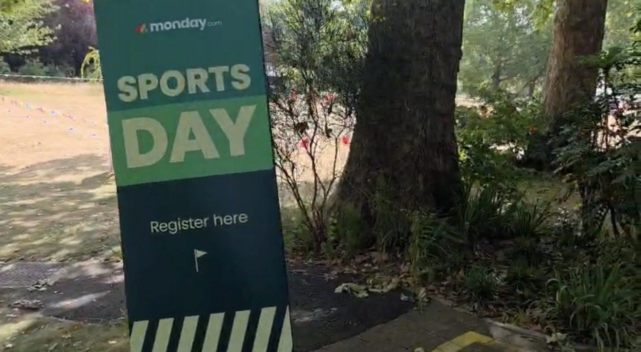 monday.com Sports Day themed signage at the summer party