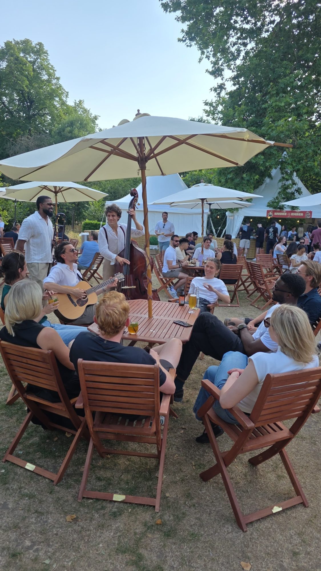 The roaming band performing up close to guests around the garden tables