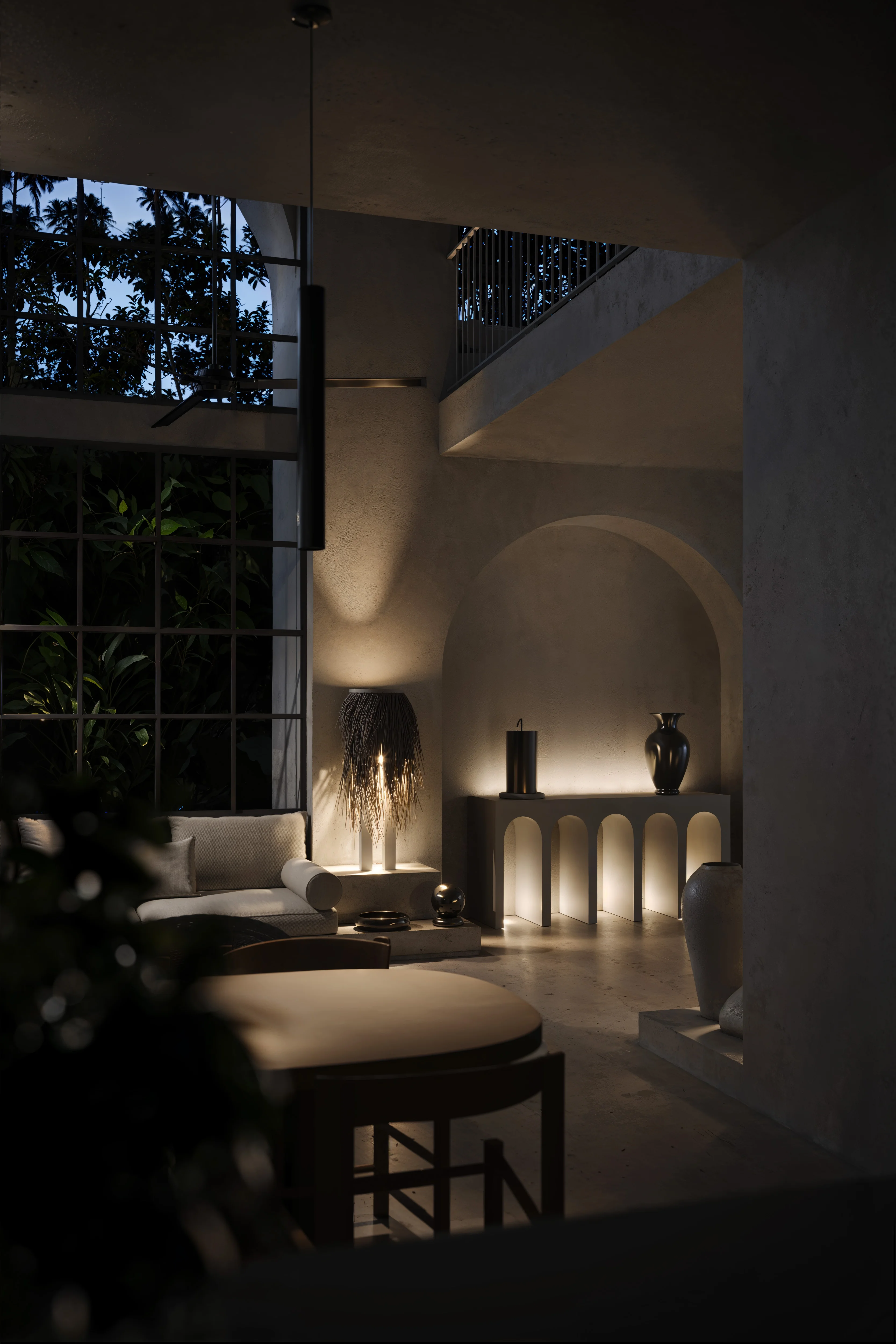 Dimly lit modern living room with large grid window, beige sofa, round dining table, and illuminated arch-shaped console table with decorative vases.