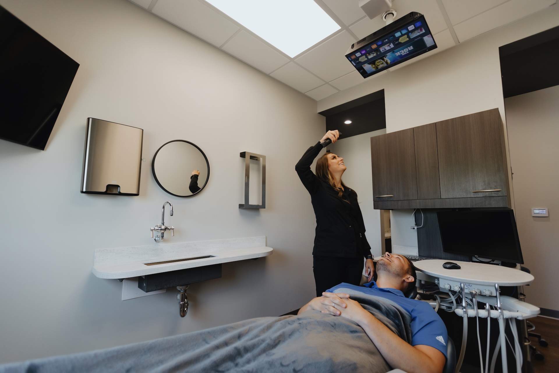 dental hygienist makes sure the patient is comfortable at Grove City Smiles