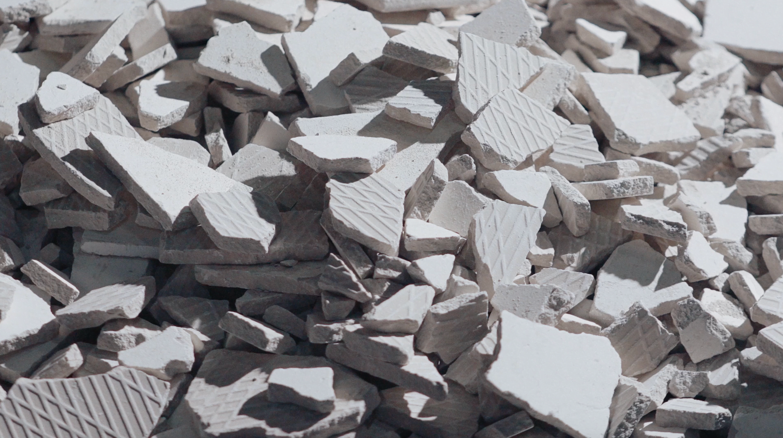 Triangle behind a mountain range made with structural grid like texture