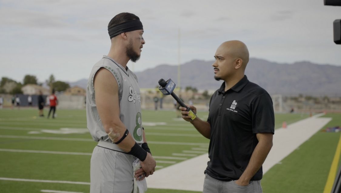 Flag football player being interviewed on the field during Las Vegas Lucky Sevens practice