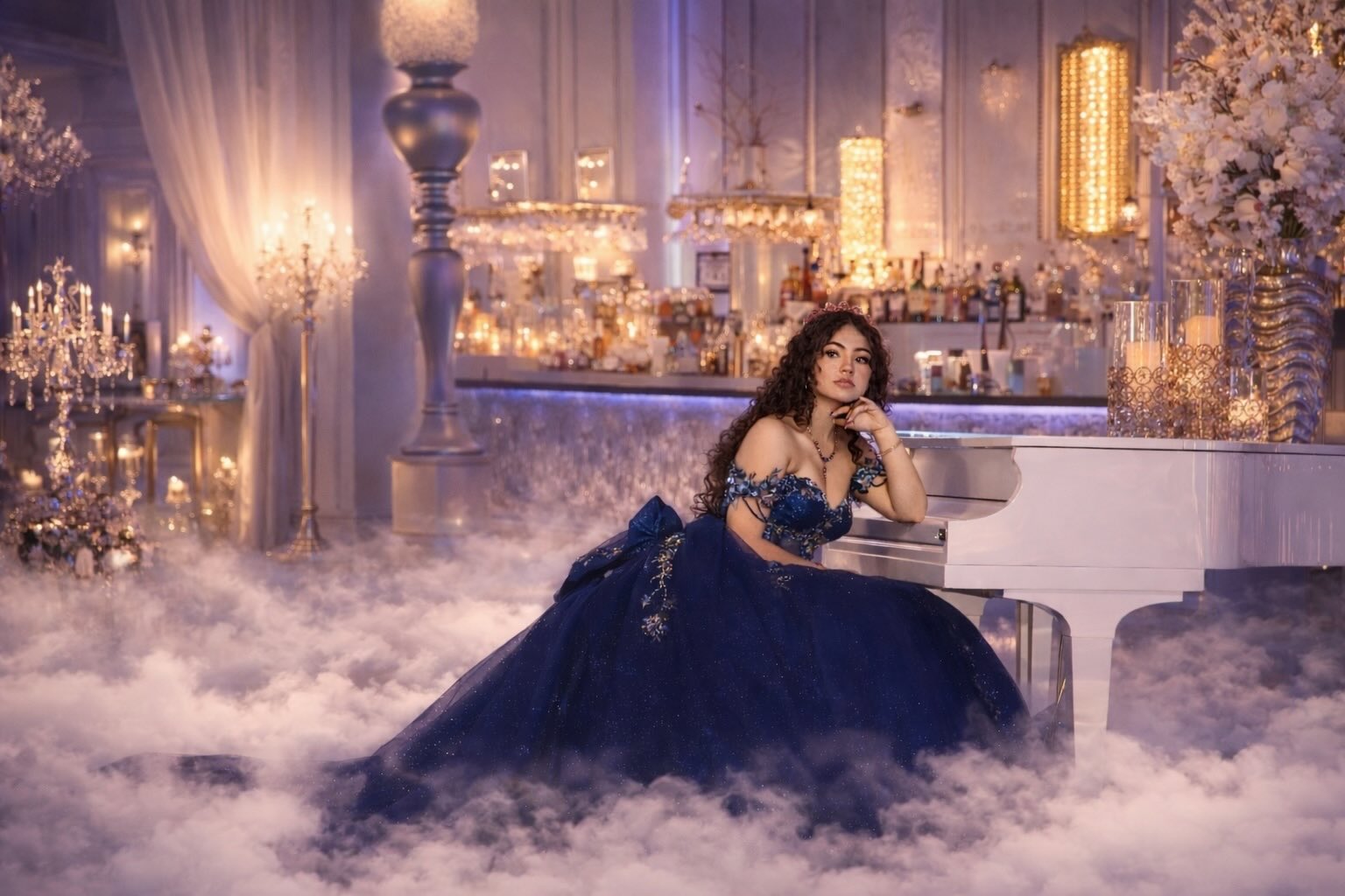 Luxury cinematic quinceañera photo featuring an elegant blue gown, white grand piano, and dramatic fog in a high-end ballroom setting