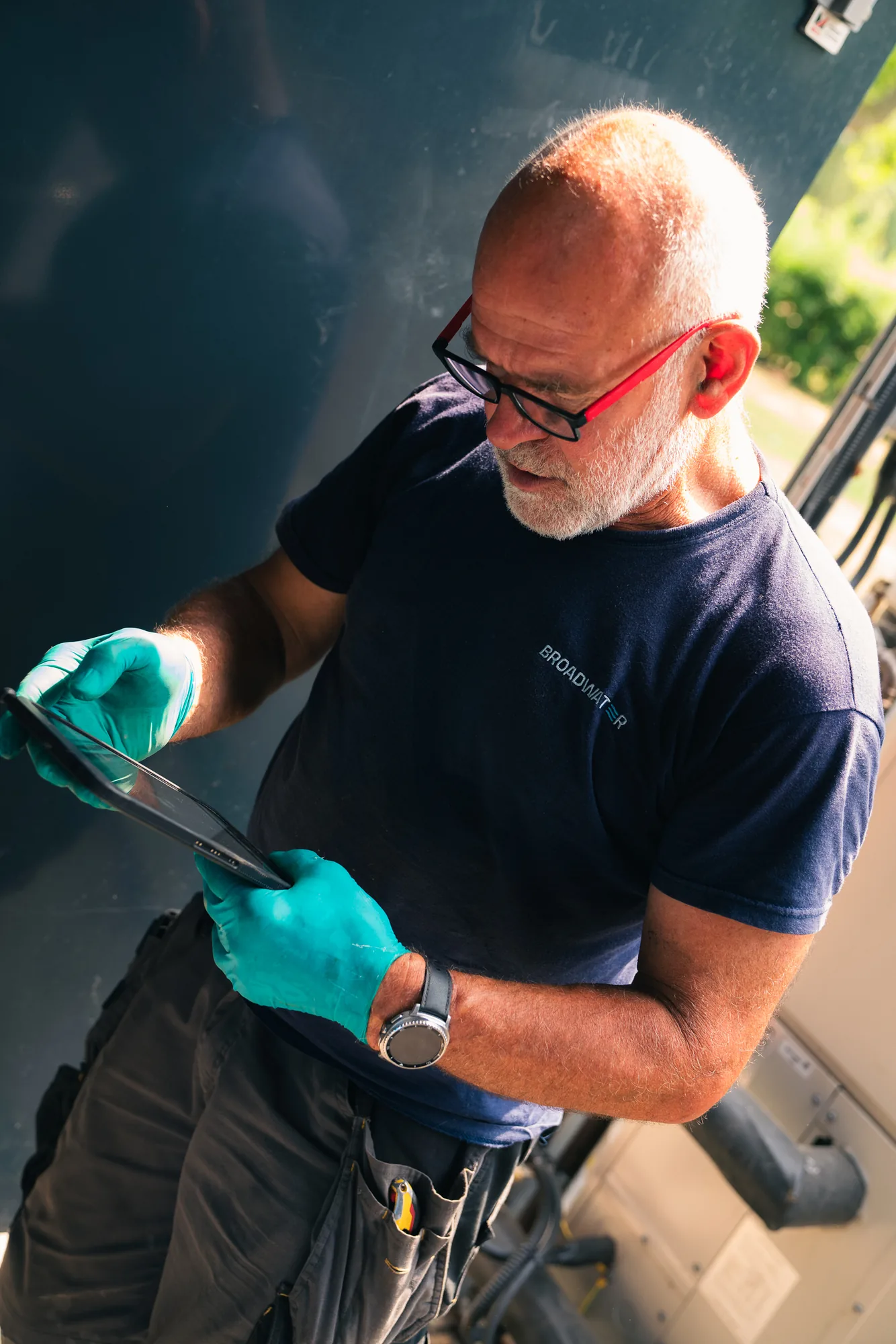 Broadwater engineer inspecting a water system during a Legionella risk assessment.