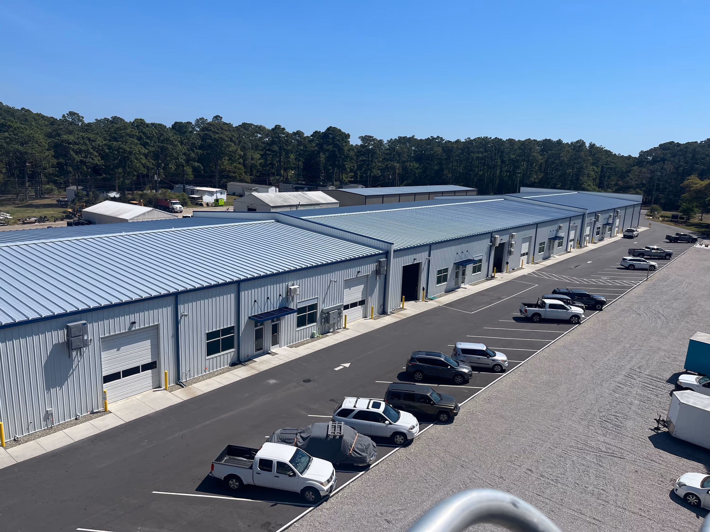 Aerial view of Kimeplex Park and the parking lot with cars parked all along it.
