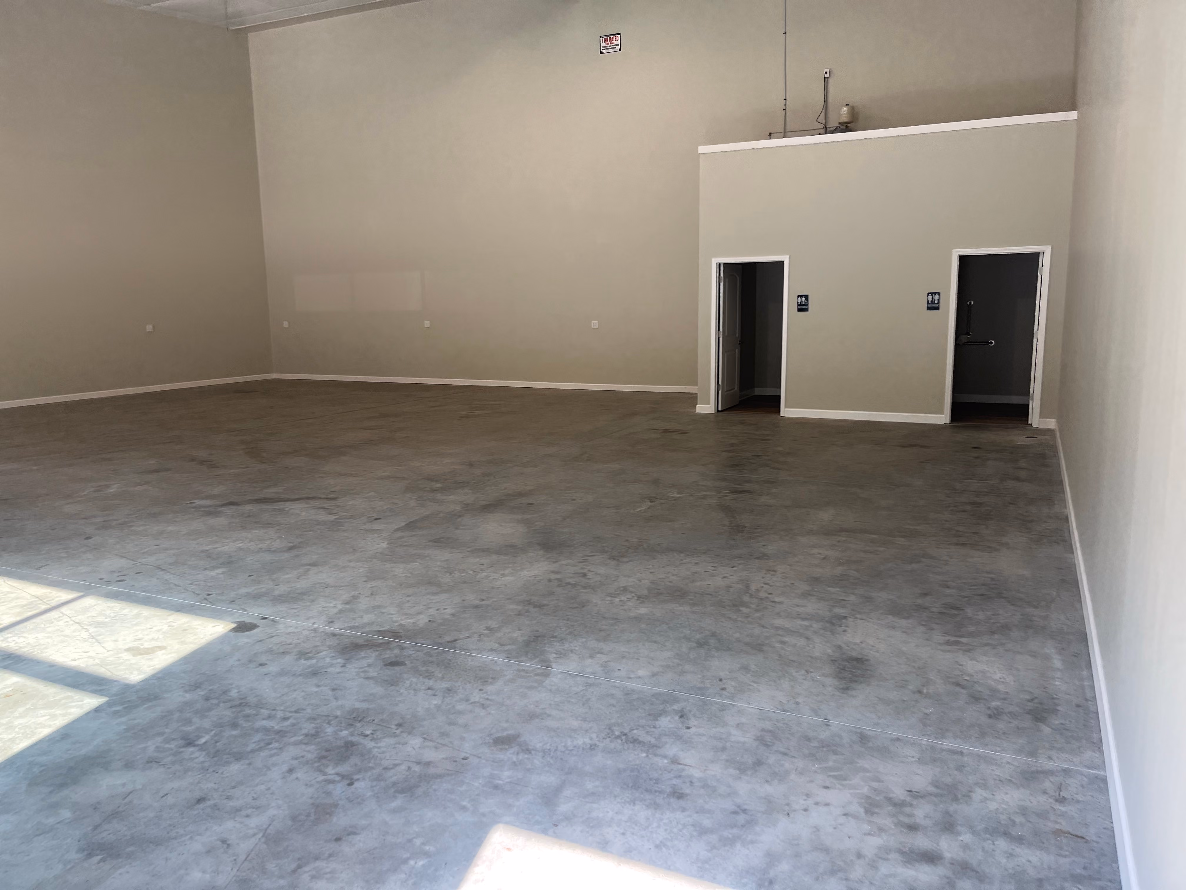 Interior of one of the spaces available at Kimeplex Park, facing the back corner where the two restrooms are located.