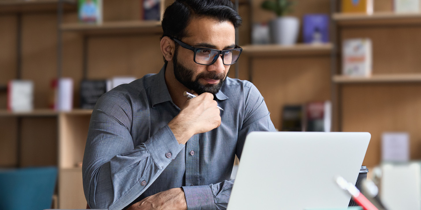 Community association professionals discussing policy documents during an HOA enforcement webinar presentation.