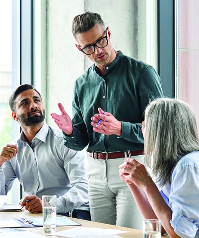 men in meeting explaining while standing
