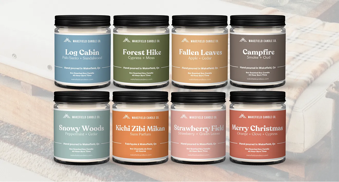 Wakefield Candle Co. candle collection featuring color-coded label designs across eight seasonal scents.