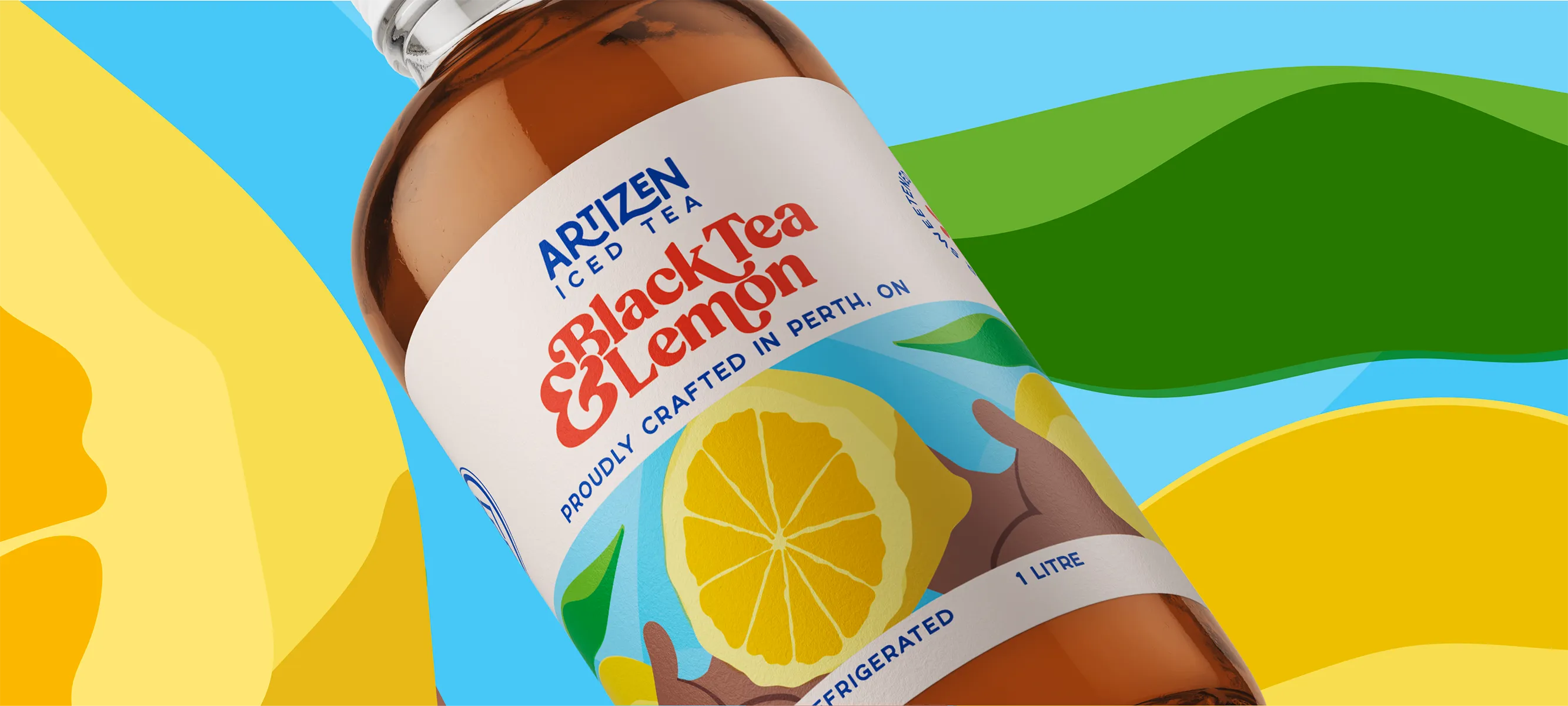 A macro portfolio crop of the premium amber glass bottle packaging for Artizen Iced Tea's Black Tea & Lemon SKU. The textured paper label features a prominent custom graphic illustration of a cut lemon slice held by hand, set against an abstract vector backdrop of rich blues, yellows, and greens.