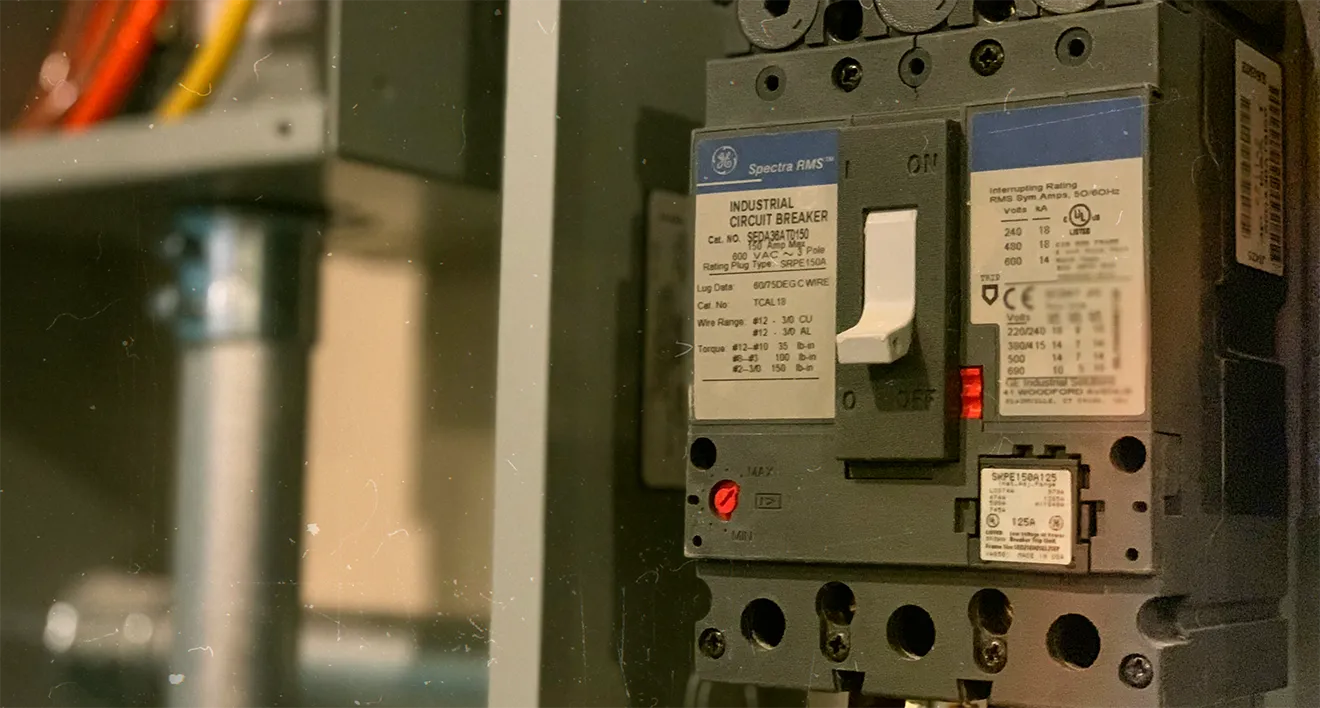 Industrial circuit breaker close-up representing Plateau Electric Co. technical and electrical expertise.