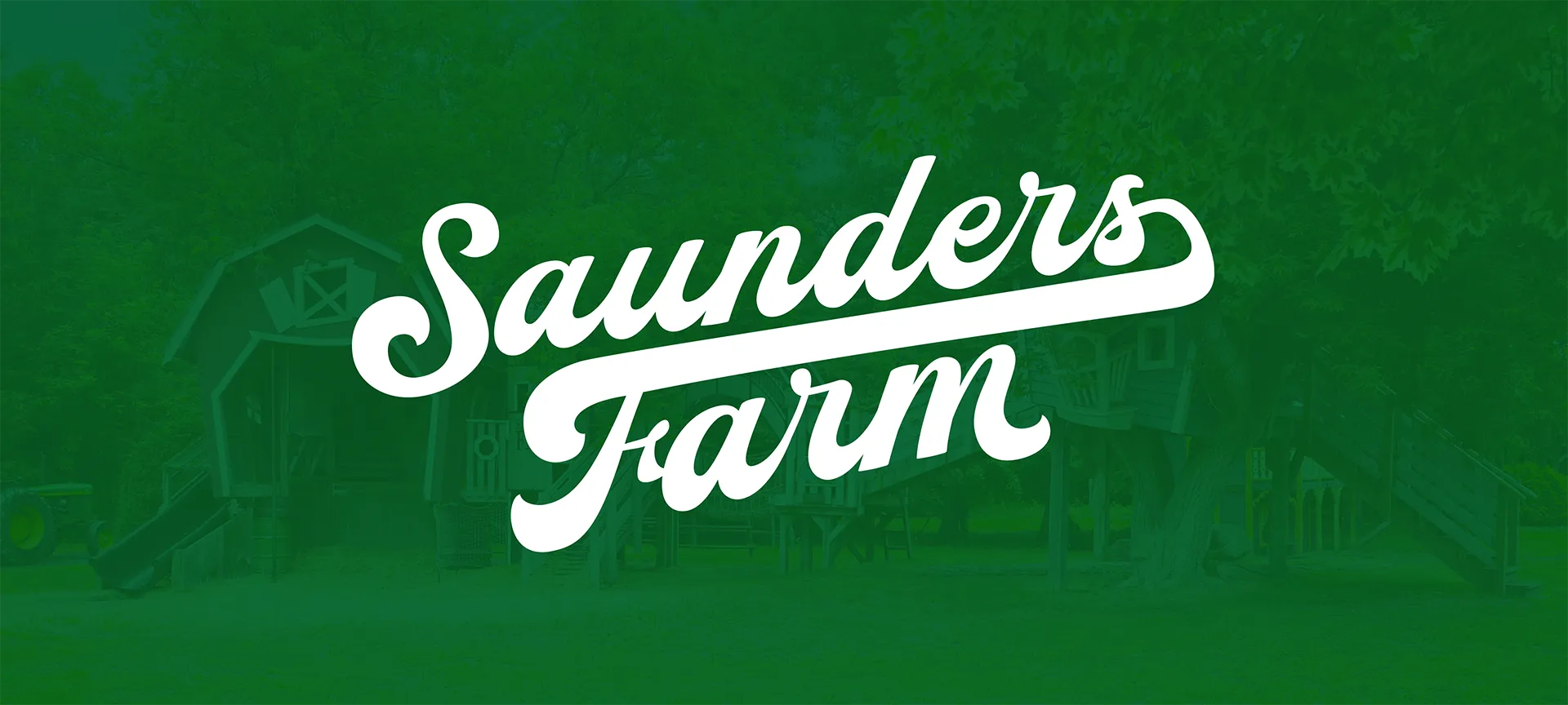 A wide environmental design asset featuring the white master Saunders Farm script logotype overlaid cleanly on a full-bleed, desaturated forest green photograph of the farm’s outdoor wooden playground structures and trees.