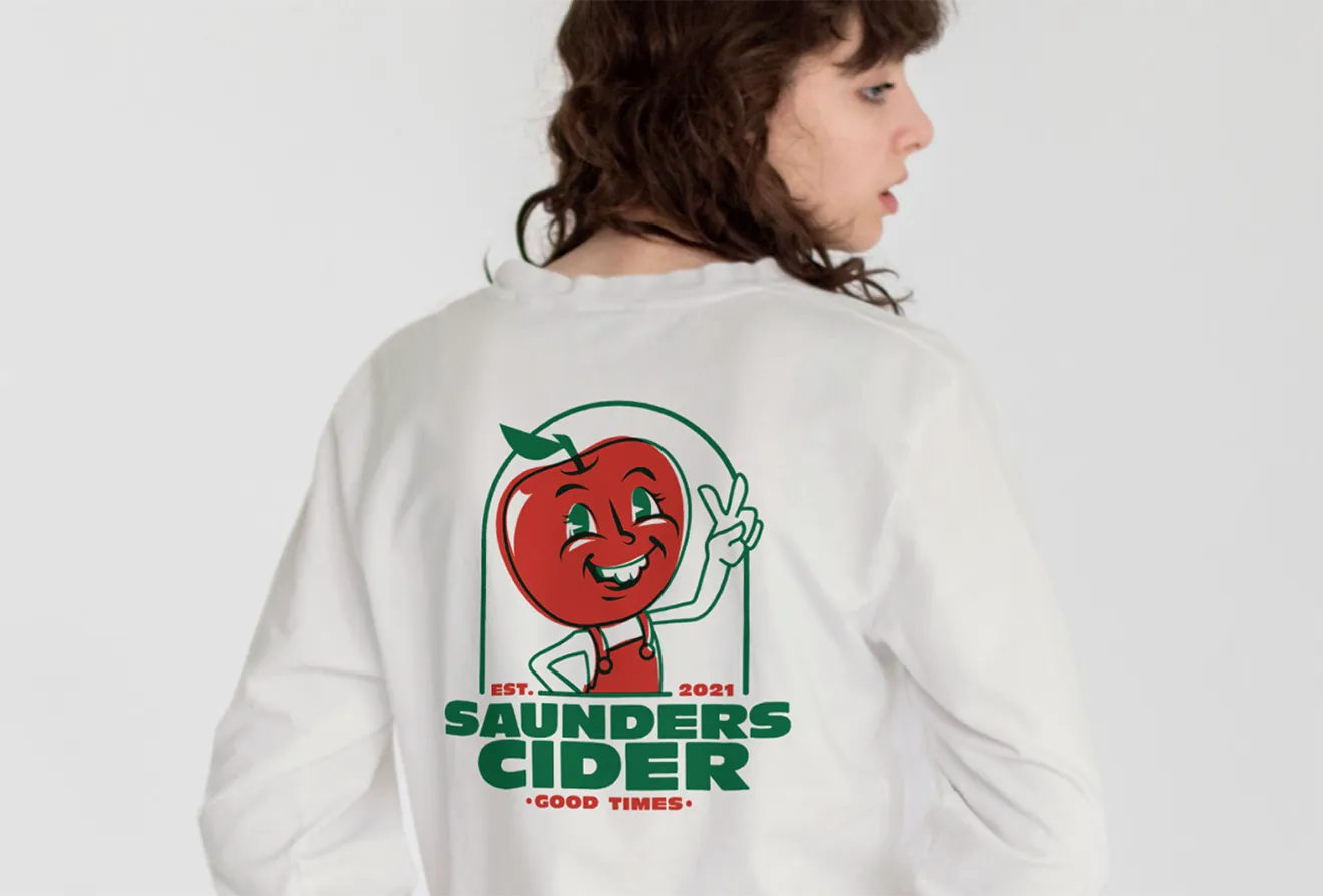 White Saunders Cider sweatshirt with Retro Apple Boy back print, illustrated by Chelle Lorenzen and designed by Hovski Studio.