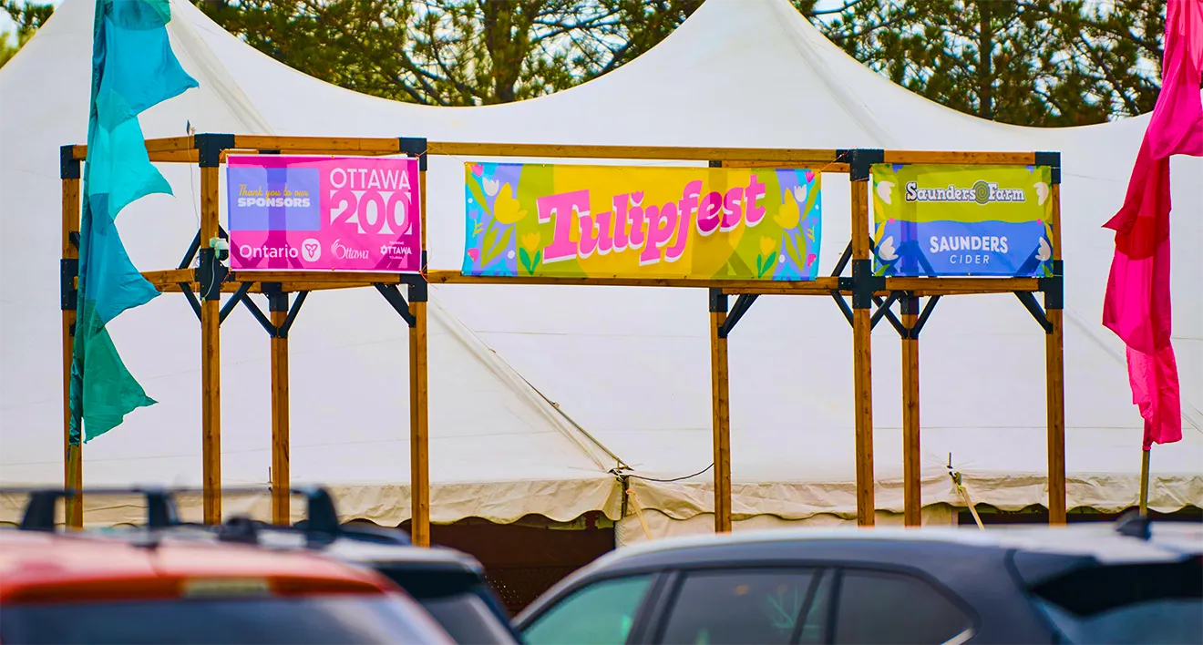 Outdoor event signage banners and sponsorship flags for Tulipfest at Saunders Farm.