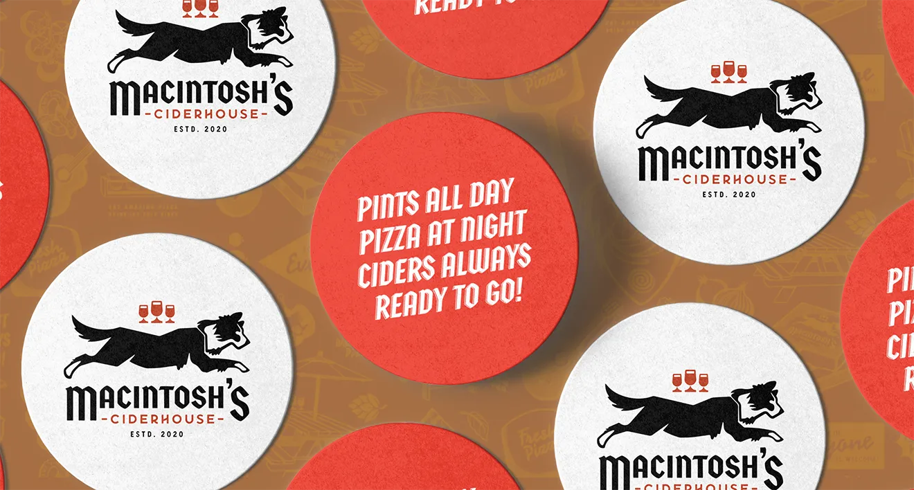 Macintosh's Ciderhouse custom printed drink coasters with brand tagline and running dog mascot by Hovski Studio.