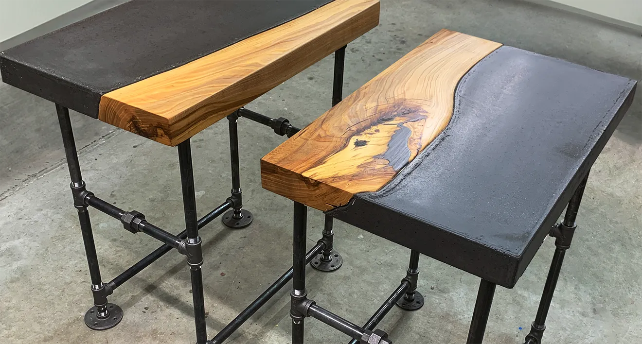 Custom hardwood block mosaic and raw black cement bench by Donahue Furniture.