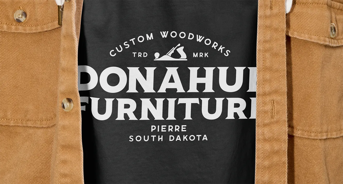 Black custom t-shirt with white Donahue's Furniture typographic logo by Hovski Studio.