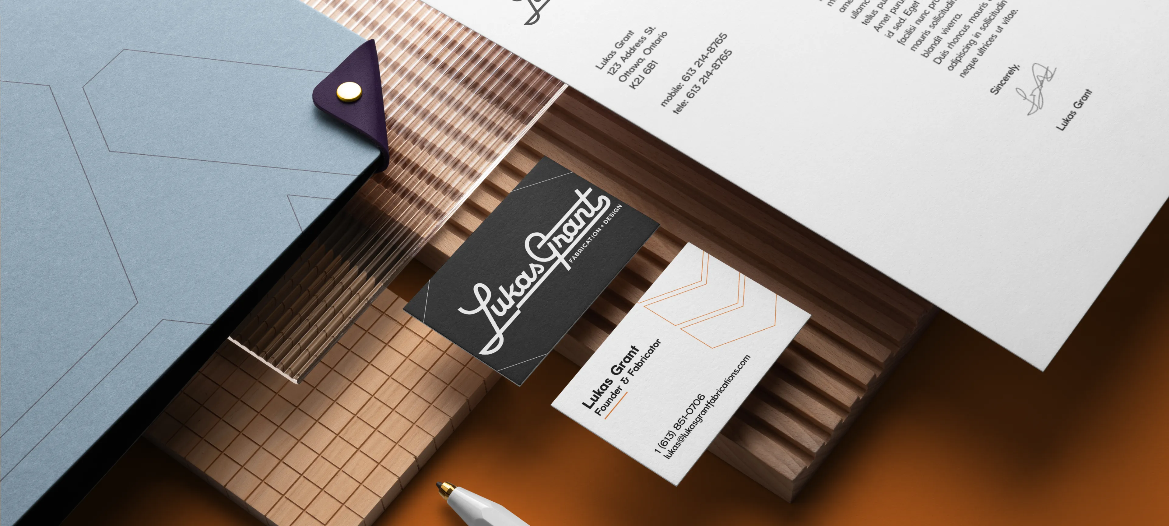 Lukas Grant visual identity design mockup by Hovski Studio featuring business cards, letterhead, and branded stationery for custom fabrication.