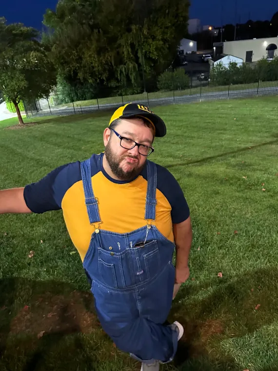 Flatland crew member in overalls hamming it up