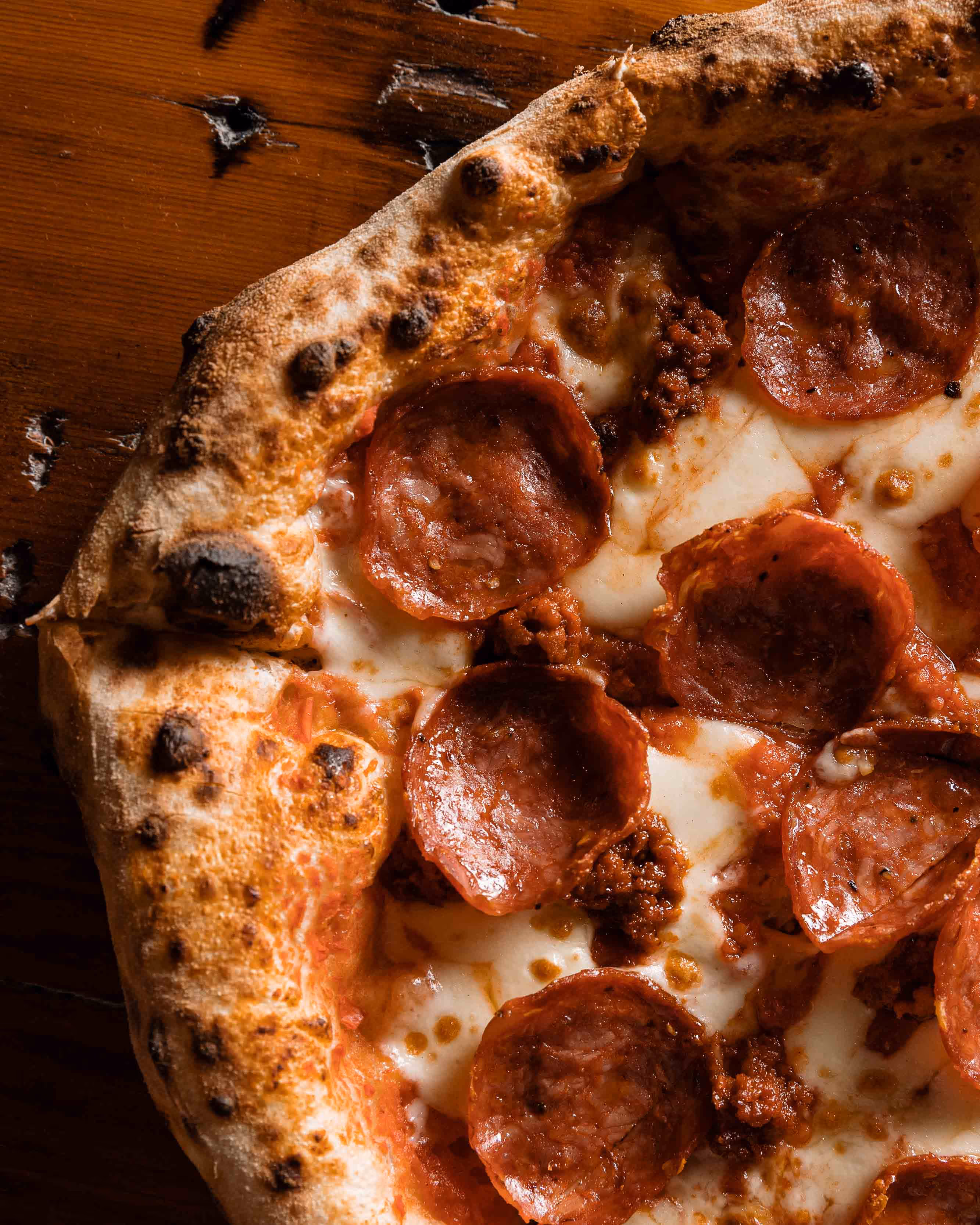Wood-fired meat lovers pizza